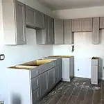 Woodex: Grey Shaker Cabinets for Apartment Complex