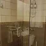 Frameless Glass Shower with Chrome Hardware