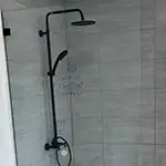 Frameless Glass Fixed Shower Panels with Matte Black Hardware