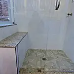 Frameless Glass Shower with Chrome Hardware