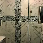 Frameless Glass Shower with Chrome Hardware and Double Towel Bar