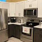 Forevermark: Ice White Shaker Wall Cabinets with Greystone Shaker Base Cabinets