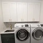 Woodex: White Shaker & Hunter Green Laundry Cabinets